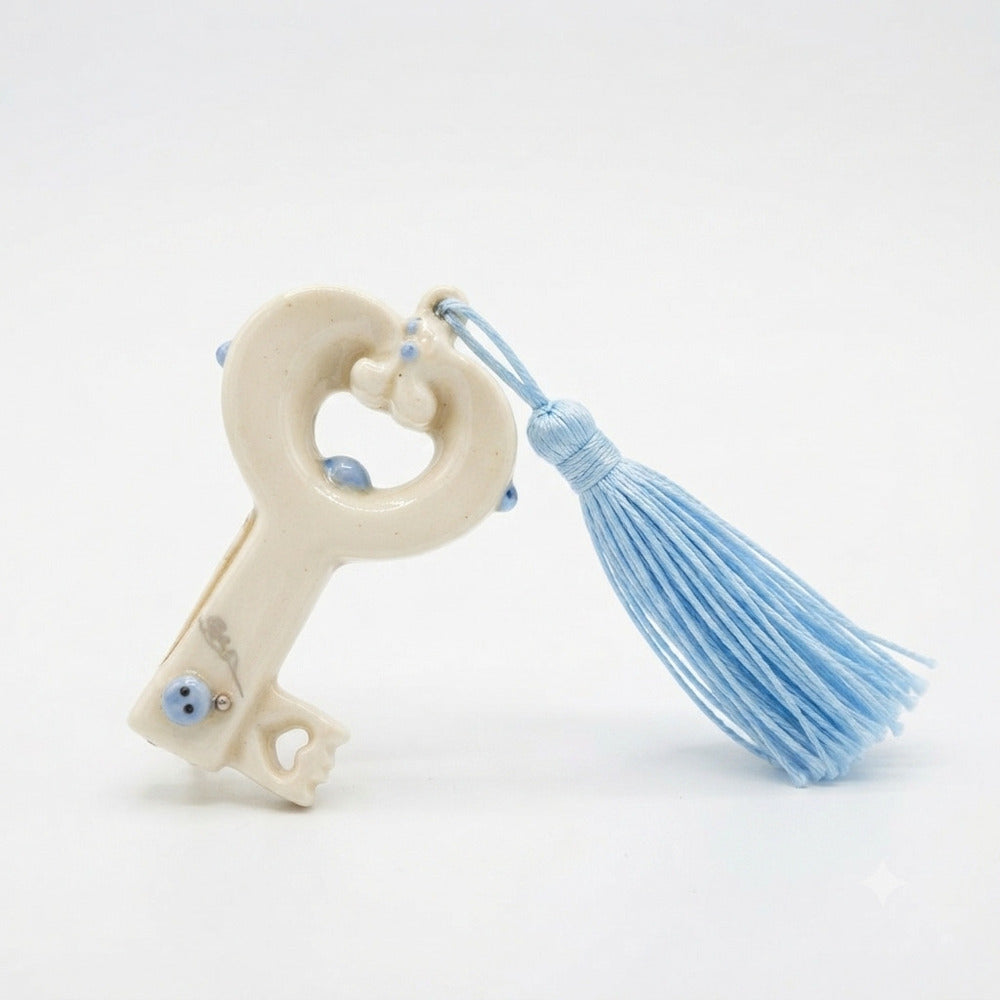 Ser Chiave Portafortuna in Porcellana con Nappina Azzurra 8x4,5 cm