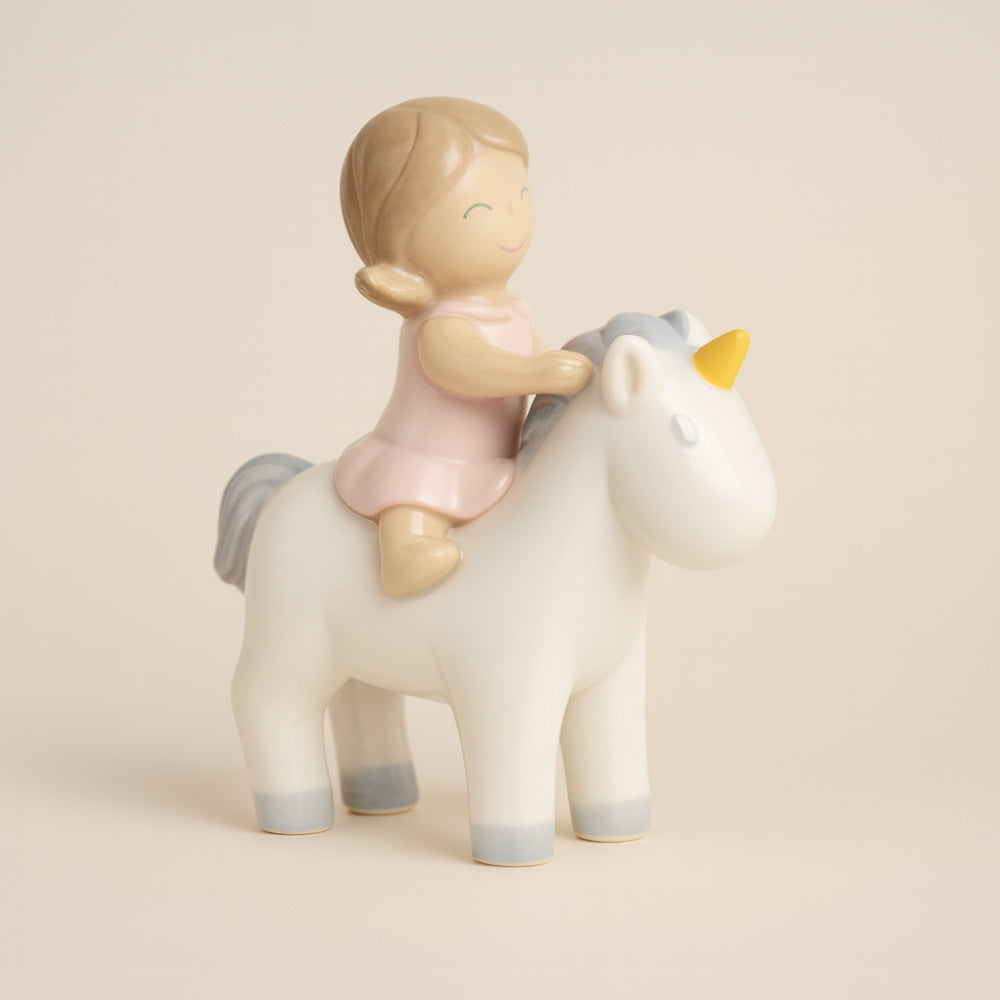 Bimba Ilary Queen su unicorno rosa in porcellana H 12,5 cm