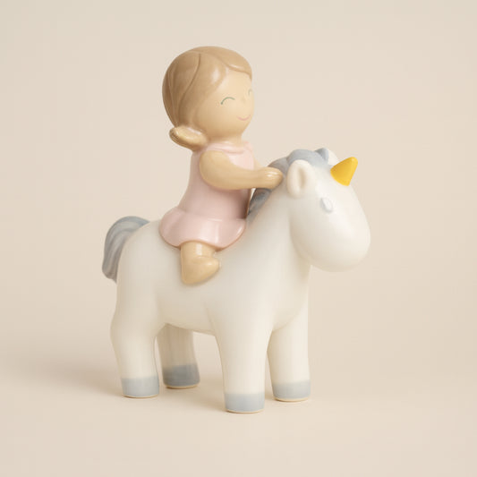 Bimba Ilary Queen su unicorno rosa in porcellana H 12,5 cm