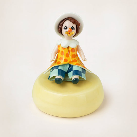 Clown con carillon Zampiva in porcellana base gialla H13 cm dipinto a mano Made in Italy